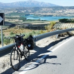 Olive groves surround the blue waters of the 'Bermejales' reservoir