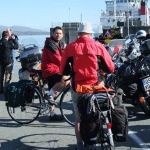 Bikers (both pedalled and powered) await the ferry